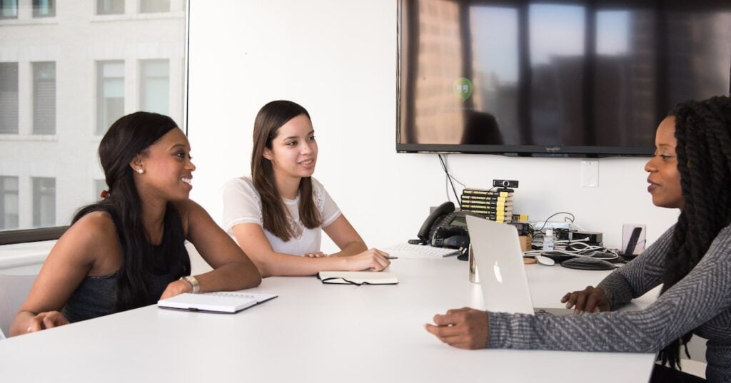 three women sitting at the table